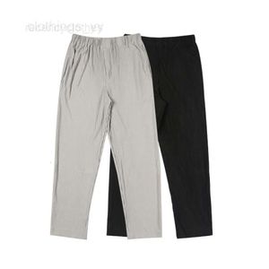 Męskie spodnie solidne kolory plisowane homme plisse spodnie mężczyźni kobiety joggery sznurki spodni potu