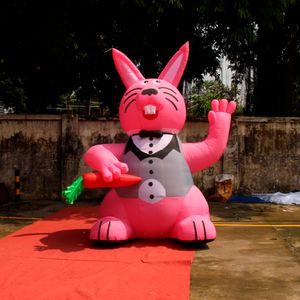 Großhandel Urlaub Dekoration Riese aufblasbare Osterhasen rosa Kaninchenmodell mit Karotte für Dach im Freien Top -Werbemaßnahmen