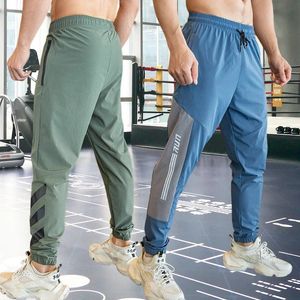 Мужские тренажеры фитнес бег с спортивными штаны спортивные укороченные штаны на открытом воздухе спортивные брюки эластичные талии карманы на молнии 240418