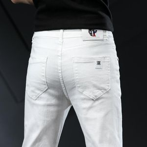 Män sträcker mager jeans mode casual smal fit denim byxor vita byxor manliga märke kläder för chinos mäns 255u