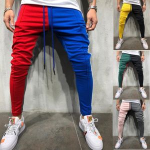 Calça masculina Novo estilo quente de estilo masculino calça atlética casual de retalhos de retalhos calças de fitness de hip hop masculino atlético 279v