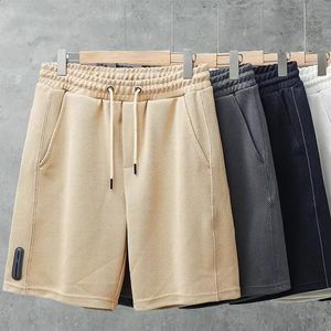 2024 Shorts casual di waffle da uomo estivo pantaloncini sportivi in europeo e americano sciolti e trasandato rettilineo 240418