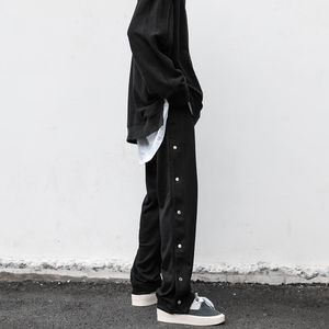 Męskie spodnie męskie odzież streetwear Streetwear Prosty sportowy przycisk boczny podzielony prosto luźne swobodne dresowe dres mężczyzn 275 W