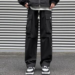 Calça de calça masculina Cantura de cordas de cordão de gola alta Carga de estilo de rua com bolsos multi -pernas largas para diariamente