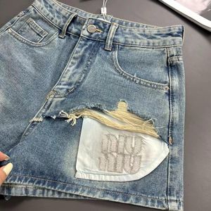 kvinnors shorts jeans kvinnor shorts miui kläder sommar ny tung industri bokstav strass dekorerad fickdesign premium tvättade denimshorts