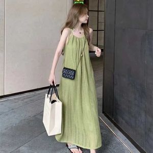 Basic lässige Kleider Lucy Ever Casual Lose Spaghetti Schultergurtkleid für Frauen Sommer Dünne Hollow Beach Kleid für Frauen Solid Korean Long Kleid Q240430