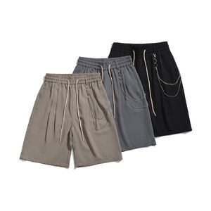 2024 Summer Ny ankomstkedjedekoration Solid färg mångsidig mitt i midjan Löst elastisk midja avslappnade lätta byxor mäns avslappnad stil shorts för daglig outfit