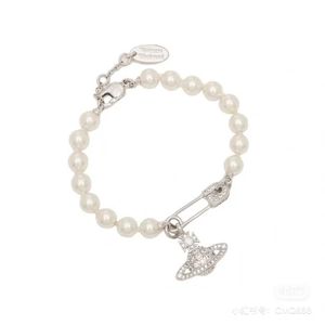 Designer Westwood Saturn studded pearl bracelet classic pin