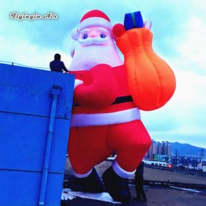 wholesale 5m 16.4ft Height Outdoor Lighting Inflatable Santa Claus Carrying A Gift Bag Climbing Building For Christmas Eve Decoration