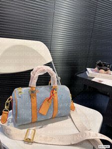 デザイナーブランドの女性ダッフルバッグデニムジャッカドレター25ナノバッグトートラガーハンドバッグ