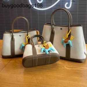 Дизайнерские садовые сумки Tote Yijinyuan New Top Cowhide Togo с Canvas 30 Premium Shopping Sudbag есть логотип
