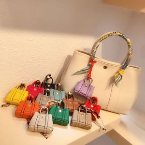 Keychains woman designer Accessories mini H Bag keyrings Premium mouth red envelope headphone bag hanger Car key chains hanger her01