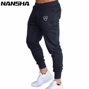 2018 Men Gyms Long Pants Mid Cotton Men's Sporting Workout Fitness Pants Casual Fashion Sweatpants Jogger Pants Skinny Trousers D18101102 226L