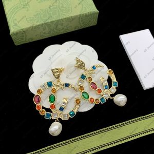 Brincos de luxo de ouro de ouro para mulheres brincos de diamante em cores penduradas brincos de jóias de pérolas de alta qualidade