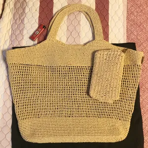 ICARE EM RAFFIAS Bolsa de designer Bolsa Mulheres de grande capacidade Bolsa de praia Pão de palha de palha de palha de topo de alta qualidade de palha