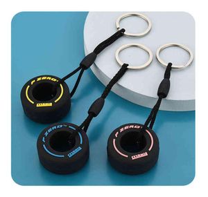 PVC Soft Rubber Tire Keychain Silicone F1 Mini Söt däckbil nyckelringar Bag dragkedja dekoration charms gåvor för unisex y04145749498