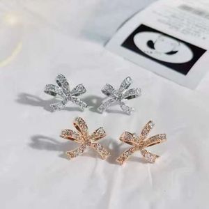 Swarovskis Brincha Designer Mulheres de alta qualidade Charme de moda de luxo Diamond Bow Bow com corações de seda de seda Brincos de cristal de borboleta para namorada