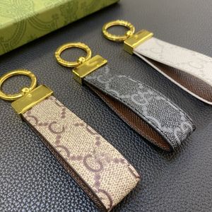 Chaves de couro de alta qualidade clássico requintado de luxo de luxo cartas de liga de zinco de cartas de zinco cartas masculinas e femininas