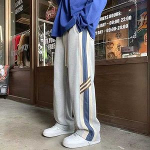 Men's Pants American street fashion striped contrasting casual pants with elastic waist drawstring pocket and loose straight pantsL2405