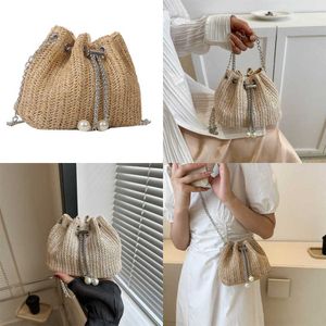 Unique Female Evening Beach Bags Design Solid Color Drawstring Bucket Bag Summer Fashionable Grass Woven Western Style Chain Crossbody