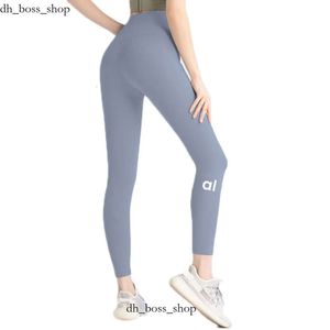 Calças de ioga feminina alinham leggings com bolsos de altura de cintura de cintura de altura fitness terno de fitness lycra cor de cor sólida calça de fundo elástica