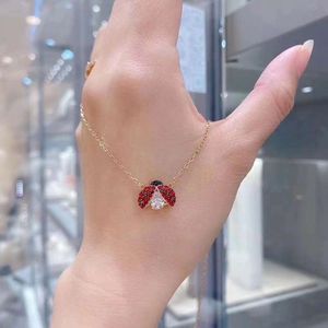 Smycken swarovskis halsband designer kvinnor original kvalitet lyx mode slår hjärta sju nyckelpiga halsband kvinnlig element kristall nyckelpiga krage kedja