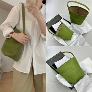 Högversion är pendling av kohudväska Nischen High-end stora äkta läder lyxkapacitet Rad Tote Womens One Shoulder Suede Bucket Handbag Beach Totes