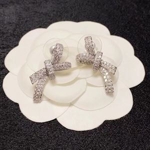 Small diamond, bow earrings, unique sense of design, advanced style, simple hair, temperament