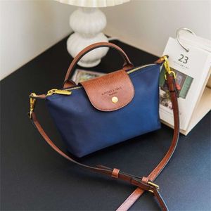 En çok satan crossbody çanta yeni% 85 fabrika promosyonu Hong Kong Satın Alma Ajanı Naylon Kontrastlar Hamurlama Küçük Momfed Moda ve Çok Yönlü Günlük Çanta