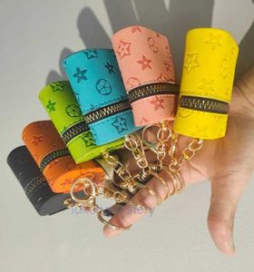 Nyckelringar Lanyards Designer Tryck Keychain Wallet Keyring Purse Pendant Car Chain Charm Bucket Bag Flower Mini Mynt Holder Keychains Bag Trinka Gif