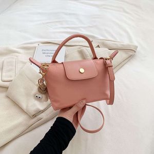 Handla bästsäljande crossbody väska nya 85% fabrikskampanj dumpling bulle ny jord kvinnor lätt crossbody väska mini telefon noll plånbok populär enkel axelväska