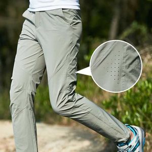 Men's Pants Summer breathable mesh ice silk quick drying mens loose elastic outdoor hiking casual sports pants J240507