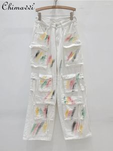 Frauen Jeans 2024 Frühlingskleidung Mode weiße Jeans große Taschenfarbe handbemalte Hosen unregelmäßige Kordelzugfrauen Frauen
