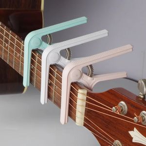 Klasyczne akcesoria do gitary elektrycznej Plastikowa stalowa przenośna elektryczna gitara Capo Guitarra Stringed Instruments