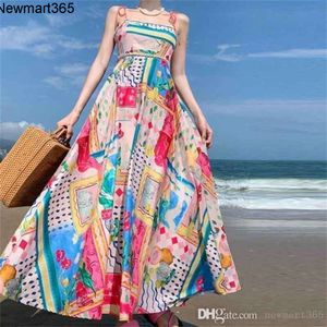 Kvinnaklänningar designer sommaren ny ärmlös kragefri hög midja tryckt färgad slitage stor hem hängande rem klänning