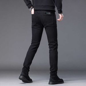 Czarne czyste dżinsy dla męskiej wysokiej klasy design proste i wszechstronne modne szczupły dopasowanie Elastyczne małe spodnie nóg