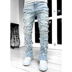 Męskie dżinsy męskie chude dżinsy fringe hip-hop surowy krawędź Elastyczna łatka Punk Rock Long Fit Stacked Dżins Pants Blue Strtwear Y240507