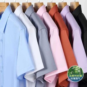 Camisas de vestido masculinas novas fibra de bambu Menina de fibra de bambu Moda de moda casual negócio de ponta curta Anti-Riuste de cor sólida Camisa formal 6xl D240507