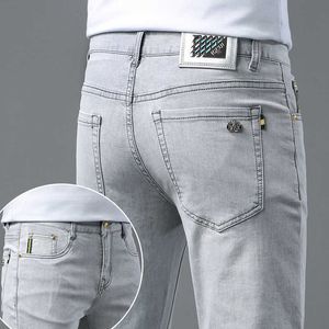 Heavenly European Silk Ultra Thin Light Grey Jeans For Men Slim Fit Small Feet Korean modemärke Mångsidiga mens långa byxor sommar