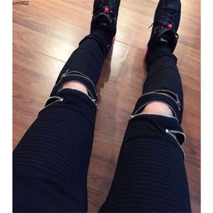 Apreciações de joelho preto dos joelhos com zíper do joelho de joelho plissado de hip hop para homens calças de corrida casuais de moto