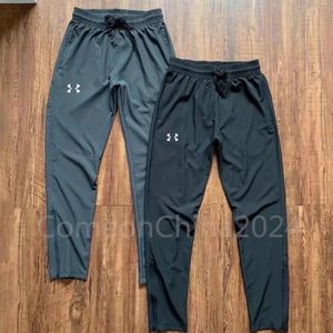 Designer de marca fino de tendência de verão UA Treinamento rápido de secagem masculina Casual Treinamento Sportswear Pants Fitness Running Breathable Small Feoth Zippered calças compridas