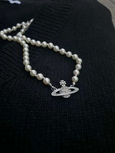 Дизайнерские ювелирные украшения подвесные ожерелья хаопайский бриллиантовый набор вдалека Сатурн Жемчужное ожерелье женского пользователя Light Luxury Full Diamond Planet Collear Colles Chaoopai