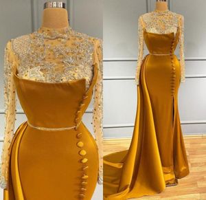 Blaskly Aso ebi arabski złota syrena wieczorowe sukienki wieczorne Strażne szyi Długie rękawy Buttons z koralikami kryształów Długość podłogi Sukienka Prom Formal8437473