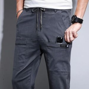 Męskie dżinsy rozciągają miękkie dżinsowe spodni mody sznurka związana harem spustki męskie ubranie marki