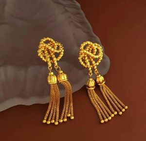 Creative knotted golden earrings retro thread tassel long ball elegant women vintgage jewelry 240506