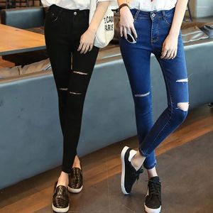 Kvinnors jeans sommar för kvinnor hög midja blyerts mager casual bomullsbyxor koreansk stil rippade hål kvinnors denim byxor