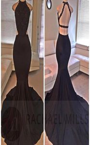 2023 Sexy Black Black Dress Halter Mermaid Mermaid Long Lace Paci di pizzo in rilievo con abiti da festa della sera a fessura posteriore senza schienale Africano ROB9276771