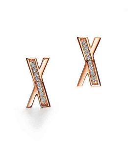 Modne nowe projektanty Lightsury Kobiety różowe złote kolczyki x w kształcie szycia kolczyki pierścienie uszu dla kobiet G2205075282948