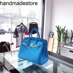 Blaue Handtasche Platinum Sky Lychee Muster Kopfschicht Rinder Frauenbeutel hell weiche Handtasche Ein Schulter Messengerbeutel handgefertigtes echtes Leder