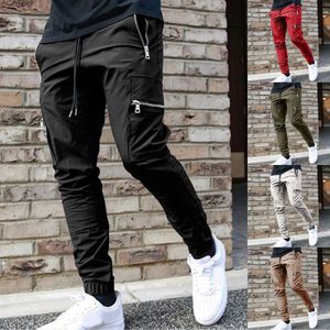 Мужские брюки Случайные брюки для мужчин 2023 Хип -хоп уличная одежда для бега брюк модные мужские много карманные повседневные брюки.